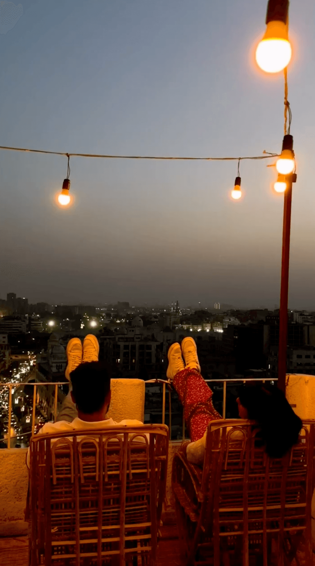 Couple at rooftop during dusk